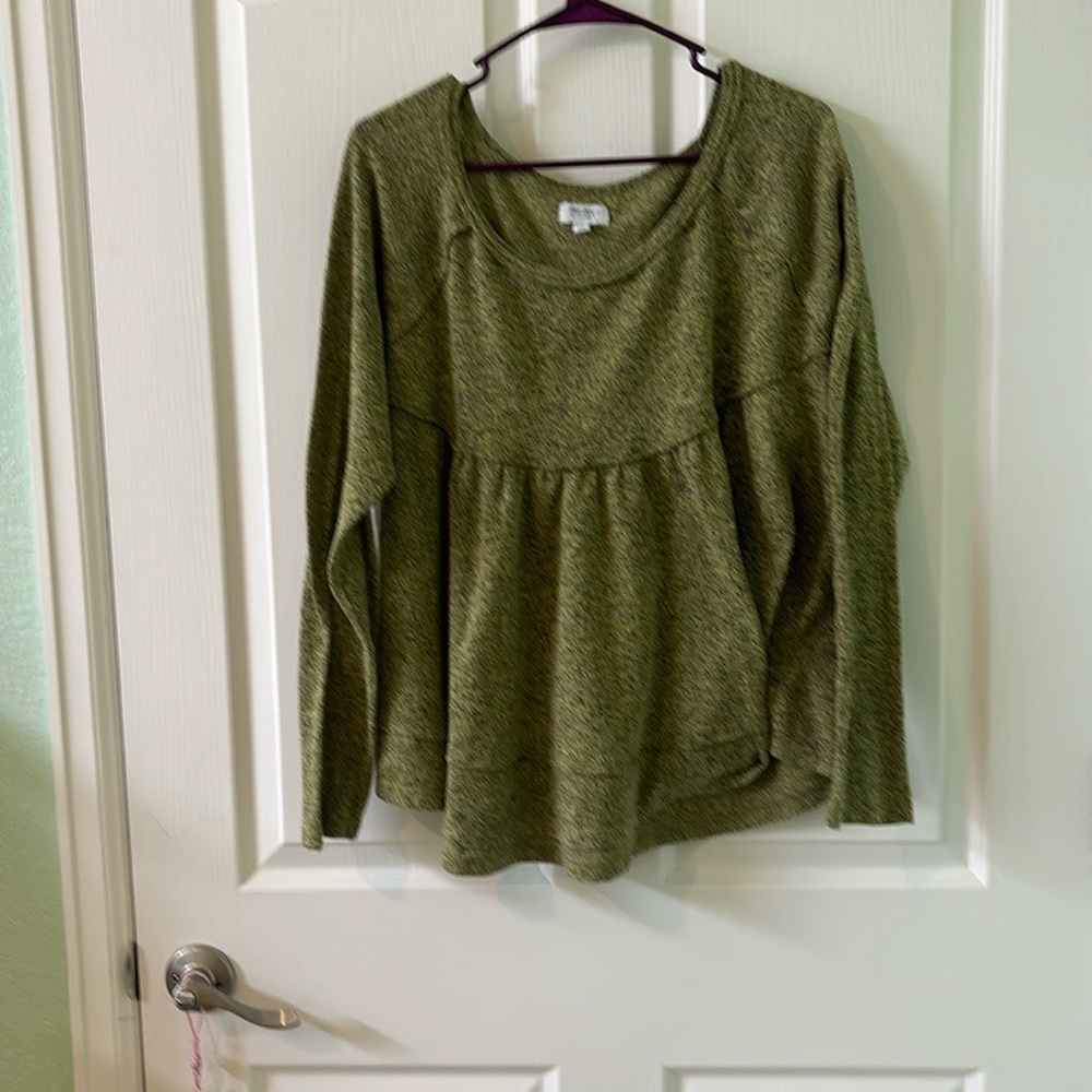 Green top with raw hems